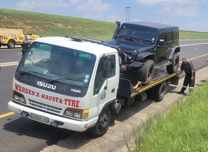Warden Exhaust & Tyre Logo